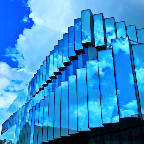 Clouds reflected in the Student Innovation Center