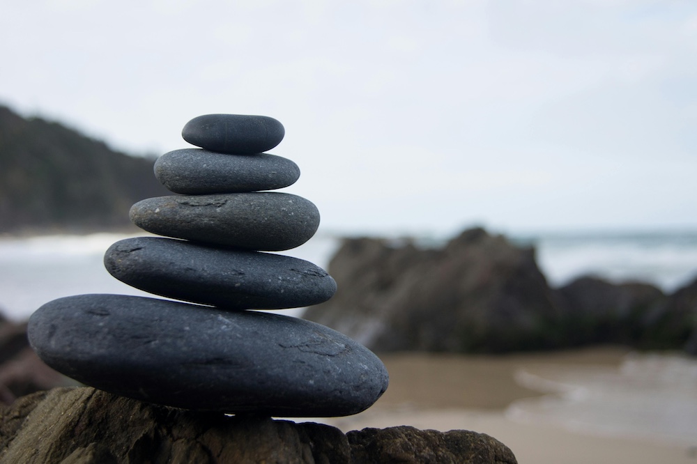 Stones balanced on a beach